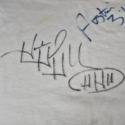 LOT 194Z: WWF Hollywood Hulk Hogan & Stone Cold Steve Austin Collection with Autographed T-shirt by HHH & Steve Austin