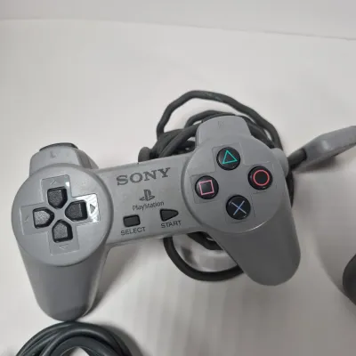 LOT 199Z: Sony Play Station Console, 4 Controllers, Memory Cards in Rolling Storage Cart