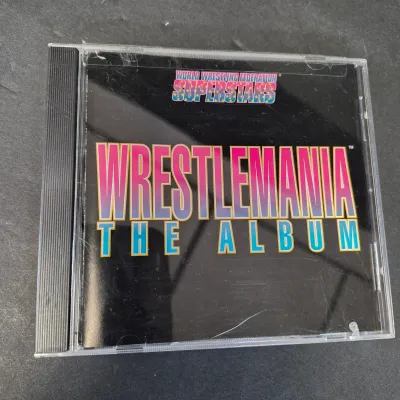 LOT 32B: WWF CD Collection with Mick Foley's Christmas Chaos Book & Bret Hitman Hart Book
