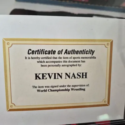LOT 190Z: WWF Kevin Nash/NWO Collection with Signed Unworn T-shirt with COA