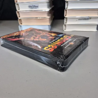 LOT 27B: Vintage VHS Clamshell Collection with Sealed "The Goonies" Movie