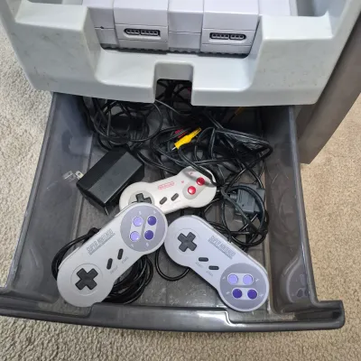 LOT 198Z: Super Nintendo Console & Controllers in Rolling Storage Cart