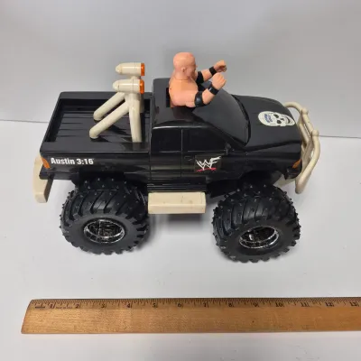 LOT 47B: Vintage WWF Titan Tron Entrance Stage & Talking/Action Monster Trucks with Undertaker, Stone Cold & Legion of Doom