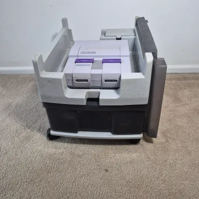 LOT 198Z: Super Nintendo Console & Controllers in Rolling Storage Cart