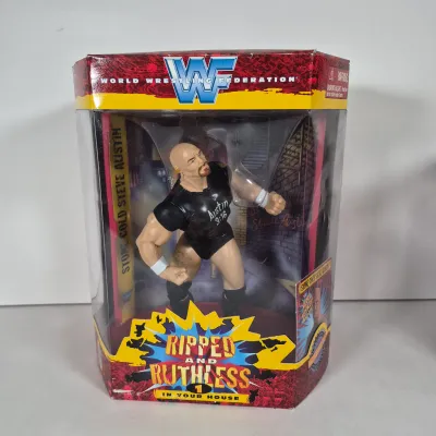 LOT 194Z: WWF Hollywood Hulk Hogan & Stone Cold Steve Austin Collection with Autographed T-shirt by HHH & Steve Austin
