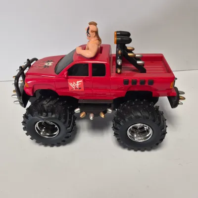 LOT 47B: Vintage WWF Titan Tron Entrance Stage & Talking/Action Monster Trucks with Undertaker, Stone Cold & Legion of Doom