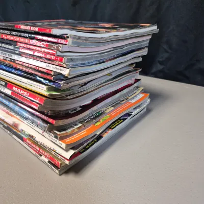 LOT 34B: Collection of Gaming Magazines-Pokémon, Prima's Official Strategy Guide, Game Informer & More