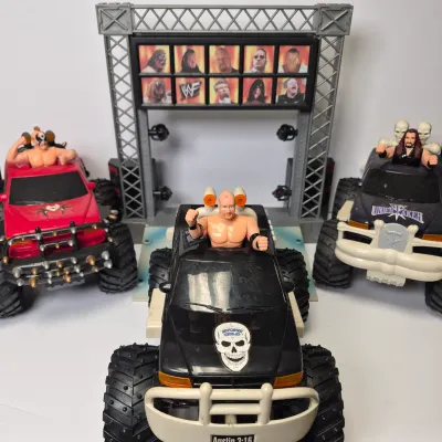 LOT 47B: Vintage WWF Titan Tron Entrance Stage & Talking/Action Monster Trucks with Undertaker, Stone Cold & Legion of Doom