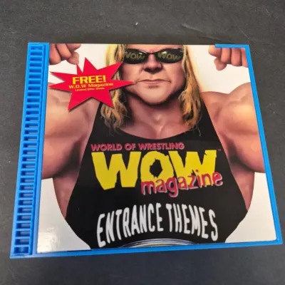 LOT 32B: WWF CD Collection with Mick Foley's Christmas Chaos Book & Bret Hitman Hart Book