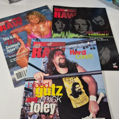 LOT 191Z: Vintage WWF Collection-Chris Jericho Autographs, Raw Magazines, Big Show Action Figure & More