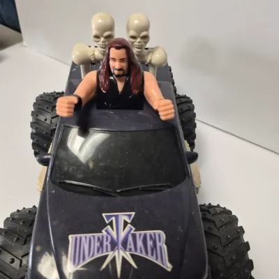 LOT 47B: Vintage WWF Titan Tron Entrance Stage & Talking/Action Monster Trucks with Undertaker, Stone Cold & Legion of Doom