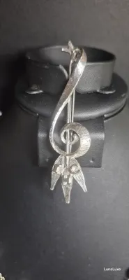 Sale Photo Thumbnail #73: G - Clef BROOCH in pewter w/ IHC logo 
> 3" brooch, IHC letter {cannot identify}
> pin perfect....great for family musician
