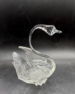 Sale Photo Thumbnail #519: Vintage clear crystal swan trinket dish featuring textured, feather-like wings and an elegant arched neck. Good condition, approx. 6" tall.