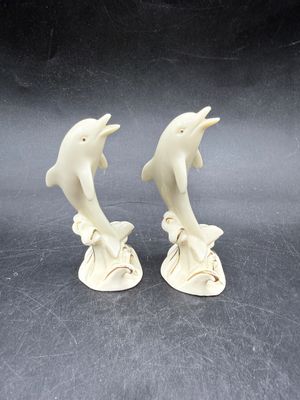 Sale Photo Thumbnail #526: Handcrafted Lenox Dolphin Figurine made of ivory porcelain with 24K gold trim accents, standing about 4 inches tall. Very good condition.