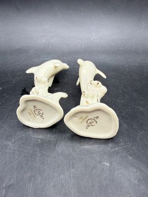 Sale Photo Thumbnail #529: Handcrafted Lenox Dolphin Figurine made of ivory porcelain with 24K gold trim accents, standing about 4 inches tall. Very good condition.