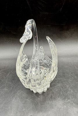 Sale Photo Thumbnail #520: Vintage clear crystal swan trinket dish featuring textured, feather-like wings and an elegant arched neck. Good condition, approx. 6" tall.