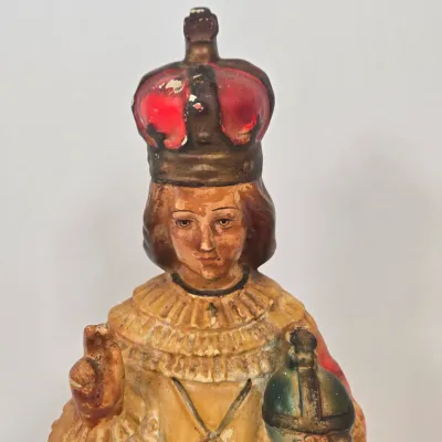 LOT 52: Statue Depicting the Infant Jesus of Prague, Multiple Scapulars, Italian-made Crucifix Pendant, and More