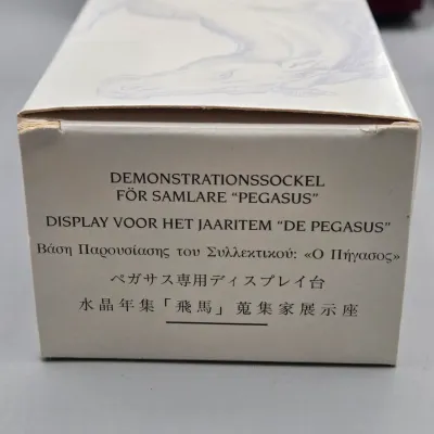 LOT 131: Swarovski Crystal Unicorn Display Stand, Collector's Display Base, and More