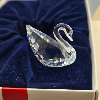 LOT 122: SWAROVSKI Crystal Snail Shell Wonder of The Sea, Scalloped Shell, Swan, and Frog Prince Figurines/ All in Original Boxes