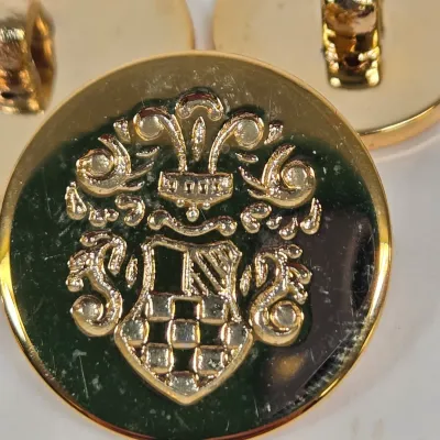 LOT 44: Multiple Sets of Vintage Gold-tone Crest Buttons and More