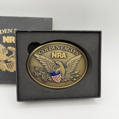 LOT 81: Two NRA Golden Eagles Commemorative Belt Buckles