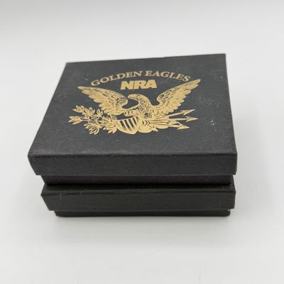 LOT 81: Two NRA Golden Eagles Commemorative Belt Buckles