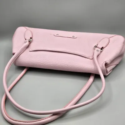 LOT 142: Pink Pebbled Leather Handbag from the Cole Haan Village Collection