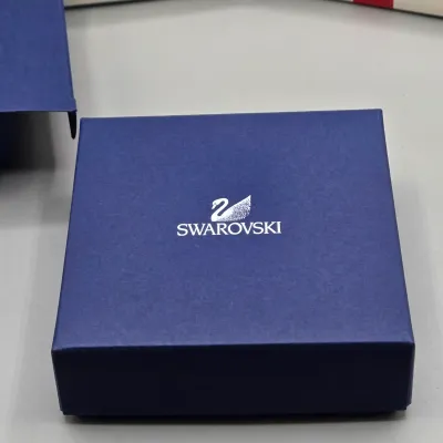 LOT 122: SWAROVSKI Crystal Snail Shell Wonder of The Sea, Scalloped Shell, Swan, and Frog Prince Figurines/ All in Original Boxes