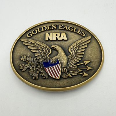 LOT 81: Two NRA Golden Eagles Commemorative Belt Buckles