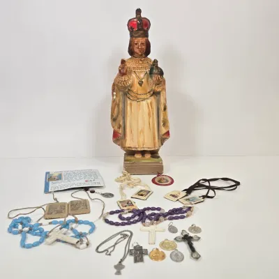 LOT 52: Statue Depicting the Infant Jesus of Prague, Multiple Scapulars, Italian-made Crucifix Pendant, and More