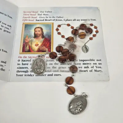LOT 52: Statue Depicting the Infant Jesus of Prague, Multiple Scapulars, Italian-made Crucifix Pendant, and More