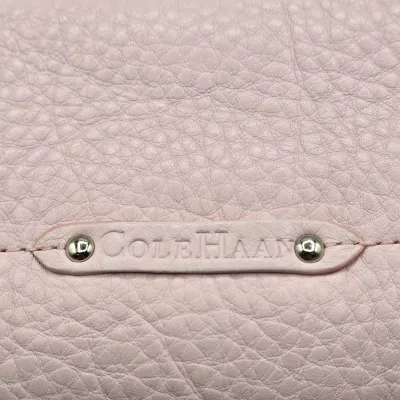 LOT 142: Pink Pebbled Leather Handbag from the Cole Haan Village Collection