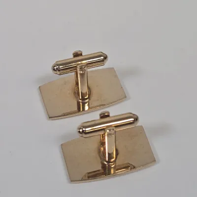 LOT 54: Swank Tie Pin with Matching Cufflinks, Vintage Caravelle Wristwatch, Socony Gas 5 Year Pin, Gold-tone WWII Honorable Discharge...