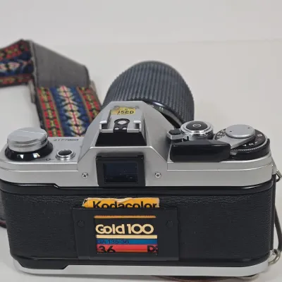 LOT 42: Vintage Canon AE-1 35mm SLR Film Camera with Telephoto Zoom Lense and Strap
