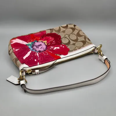 LOT 143: Coach Signature Poppy Floral Demi Clutch