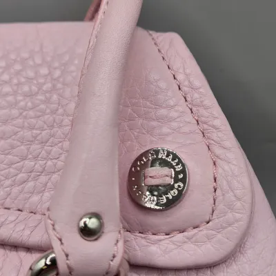 LOT 142: Pink Pebbled Leather Handbag from the Cole Haan Village Collection