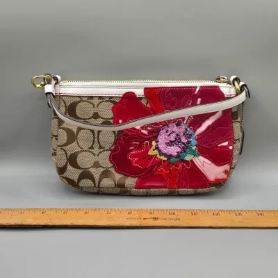 LOT 143: Coach Signature Poppy Floral Demi Clutch