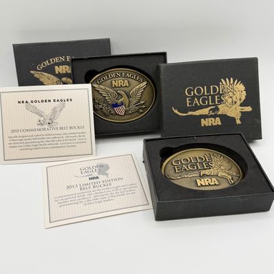 LOT 81: Two NRA Golden Eagles Commemorative Belt Buckles