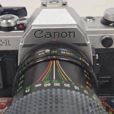 LOT 42: Vintage Canon AE-1 35mm SLR Film Camera with Telephoto Zoom Lense and Strap