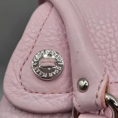 LOT 142: Pink Pebbled Leather Handbag from the Cole Haan Village Collection