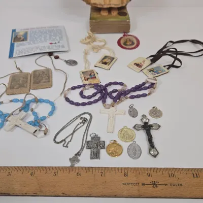 LOT 52: Statue Depicting the Infant Jesus of Prague, Multiple Scapulars, Italian-made Crucifix Pendant, and More