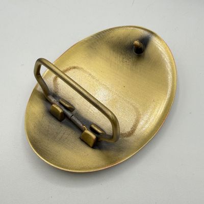 LOT 81: Two NRA Golden Eagles Commemorative Belt Buckles