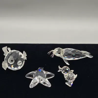 LOT 137: Vintage Retired Swarovski Crystal Blowfish, Seal, Miniature Drake, and Starfish Figurines