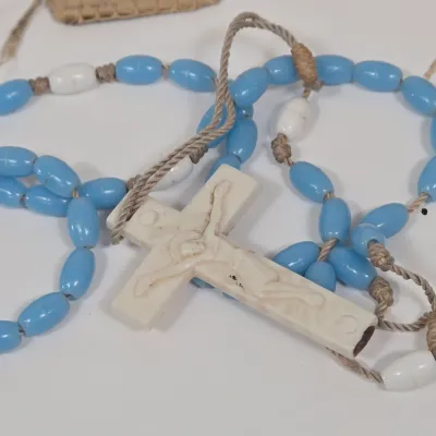 LOT 52: Statue Depicting the Infant Jesus of Prague, Multiple Scapulars, Italian-made Crucifix Pendant, and More