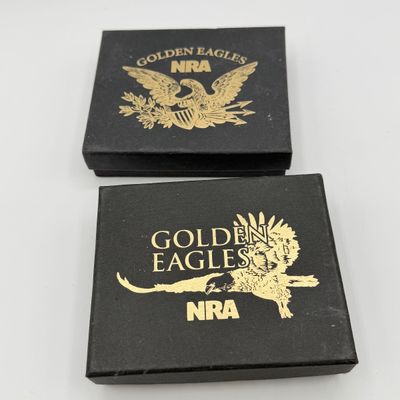 LOT 81: Two NRA Golden Eagles Commemorative Belt Buckles
