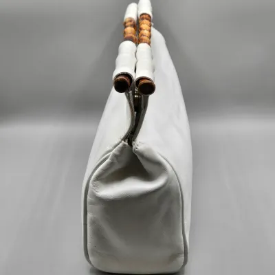 LOT 156: White Leather Handbag with a Bamboo Top Handle by Tanner Made in Italy