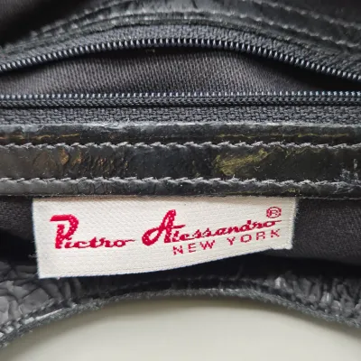 LOT 157: Black Leather Foldover Handbag by Pietro Alessandro