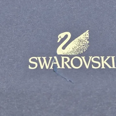LOT 122: SWAROVSKI Crystal Snail Shell Wonder of The Sea, Scalloped Shell, Swan, and Frog Prince Figurines/ All in Original Boxes