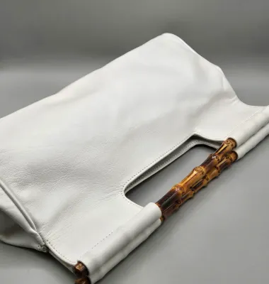 LOT 156: White Leather Handbag with a Bamboo Top Handle by Tanner Made in Italy