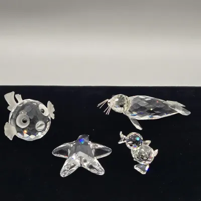 LOT 137: Vintage Retired Swarovski Crystal Blowfish, Seal, Miniature Drake, and Starfish Figurines